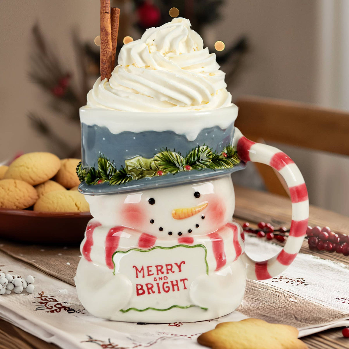 Merry and Bright snowman mug topped with whipped cream, a Honorary Grounds holiday gift